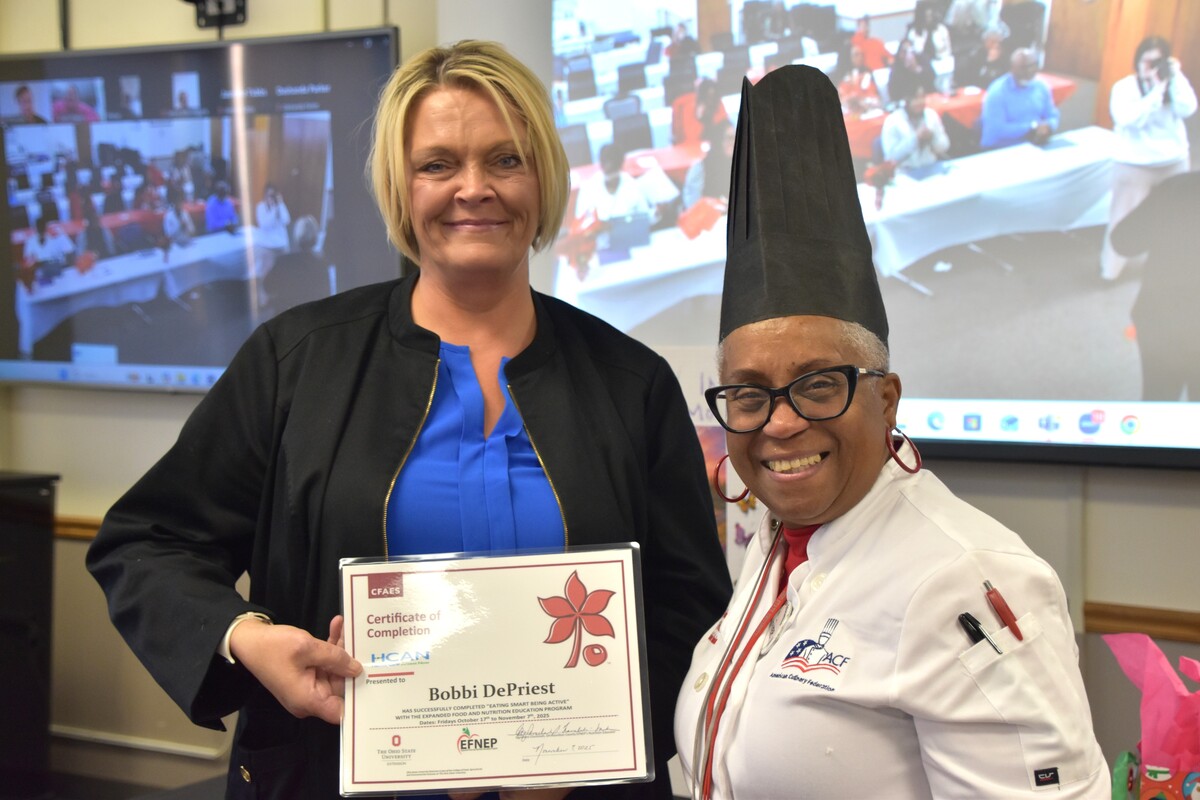 3 women holding certificates