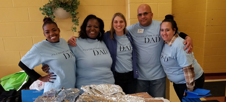Five people smiling at HCAN fathers' event