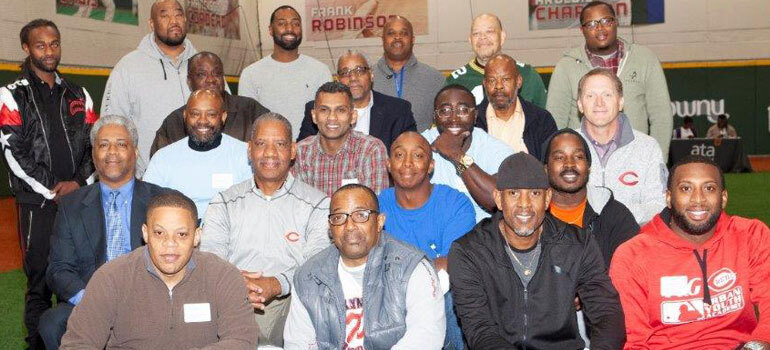 Group of 20 dads sitting and smiling