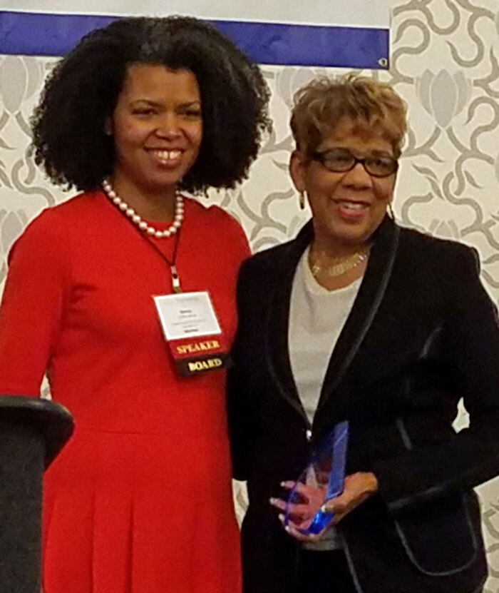 HCAN CEO Judith Warren accepting award