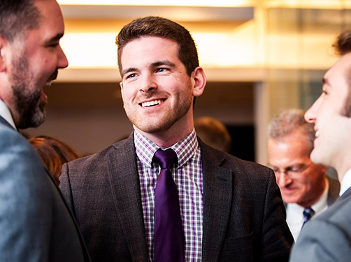 Man smiling at other people