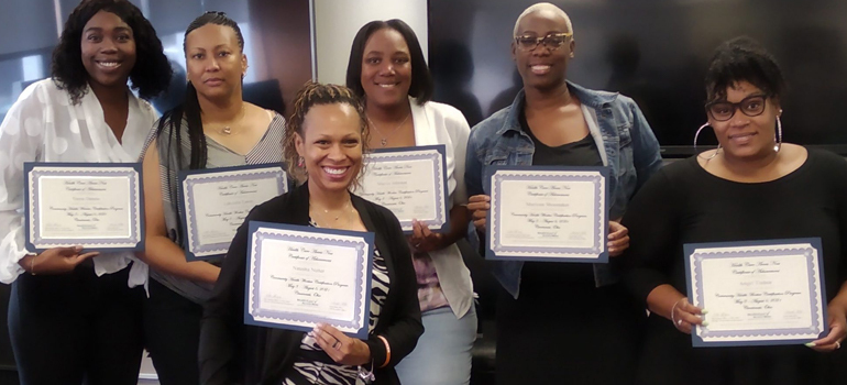 People holding certificates