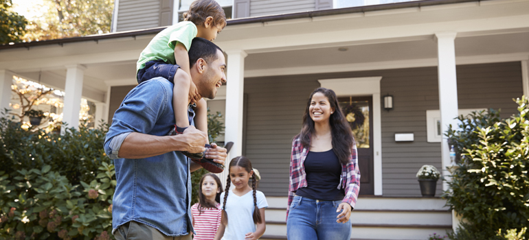 People in front of a house