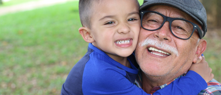Old man and child hugging