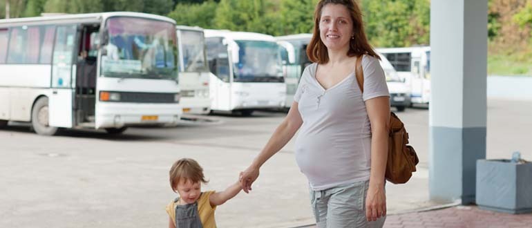 Woman holding child's hand