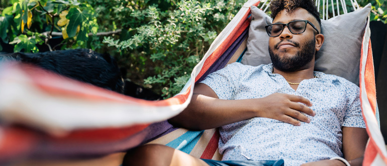 Man sleeping in a hammock