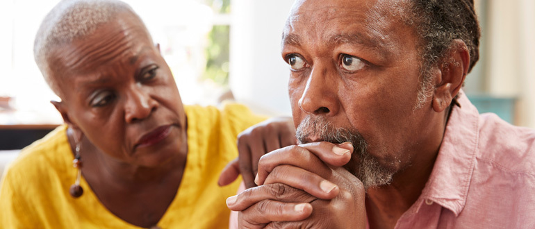 Woman looking sympathetically at a man