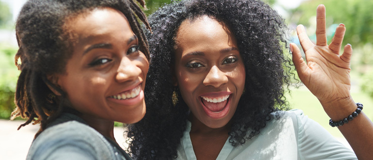 Two women smiling at the camera