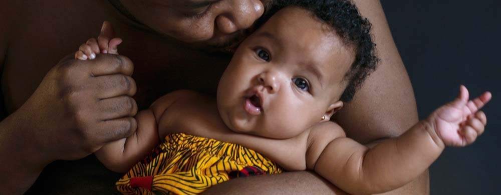 Baby in the arms of a person