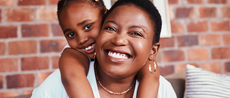 Child hugging a woman
