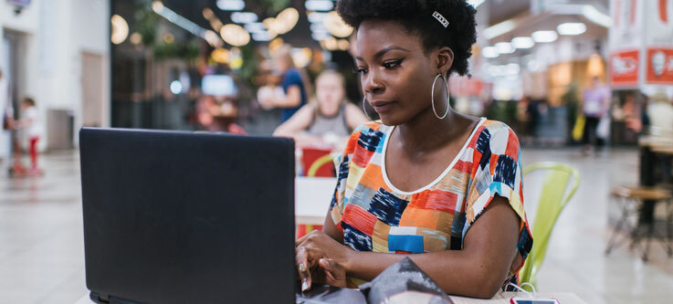 Woman typing on laptop