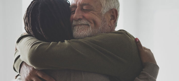 Man hugging a person