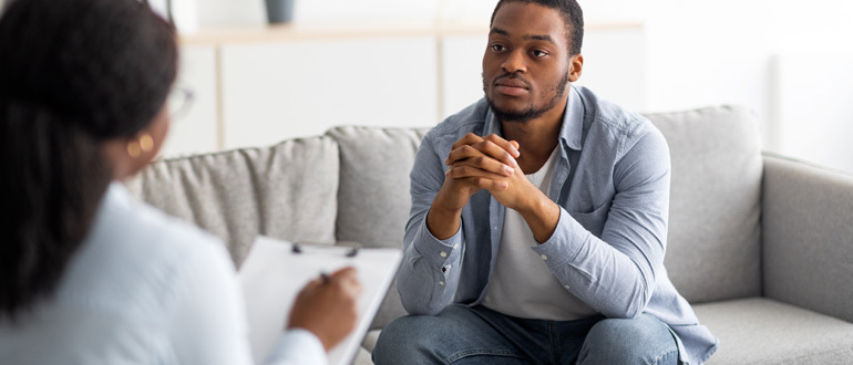 Man listening to a woman