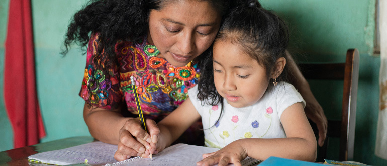 Woman teaching a child