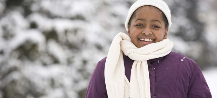 Girl in winter clothing outside
