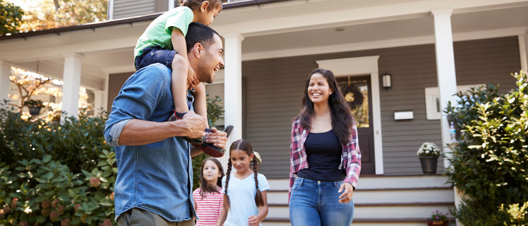 Family in front of a house