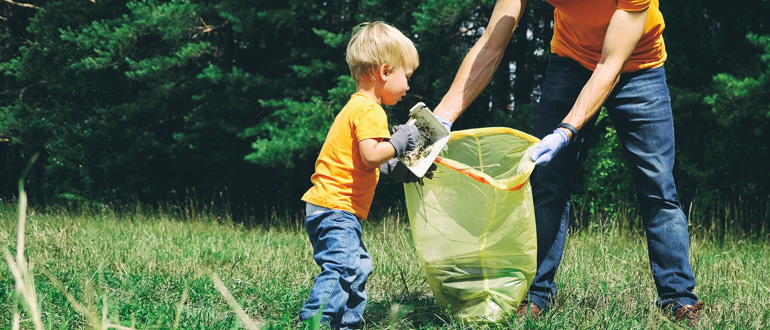 Child picking up litter