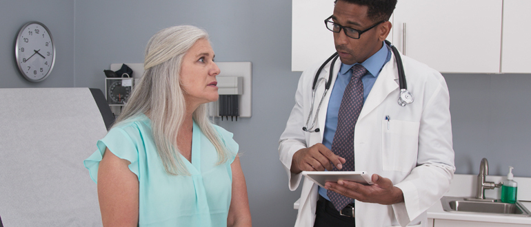 Woman listening to a doctor
