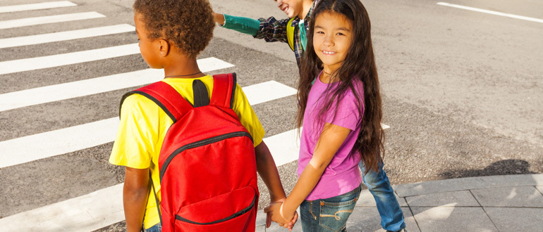 Children standing at a street corner