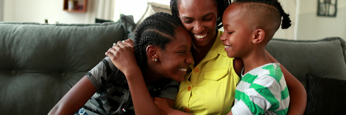 image of family hugging and smiling