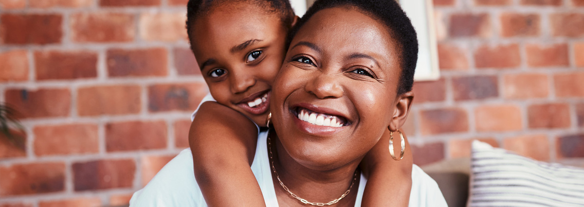 image of mother and daughter smiling
